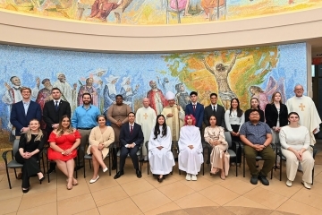 RCIA group poses for a group photo in the lobby of St. Thomas More Church