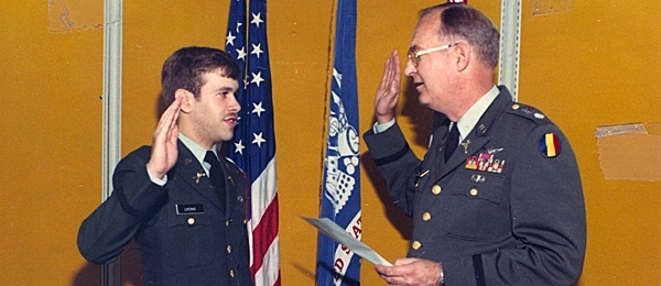 Two men saluting each other in army uniform