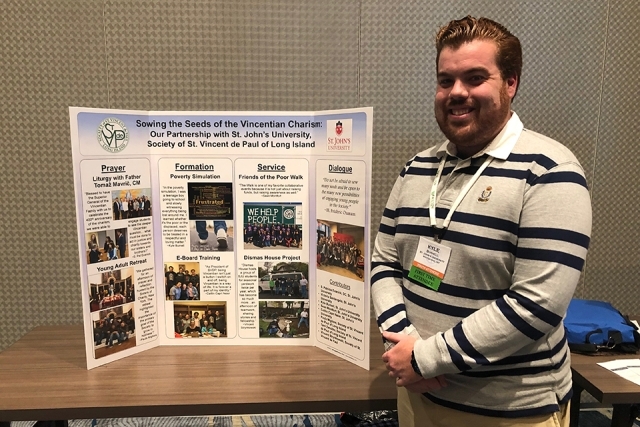 Kyle Burnell with presentation poster