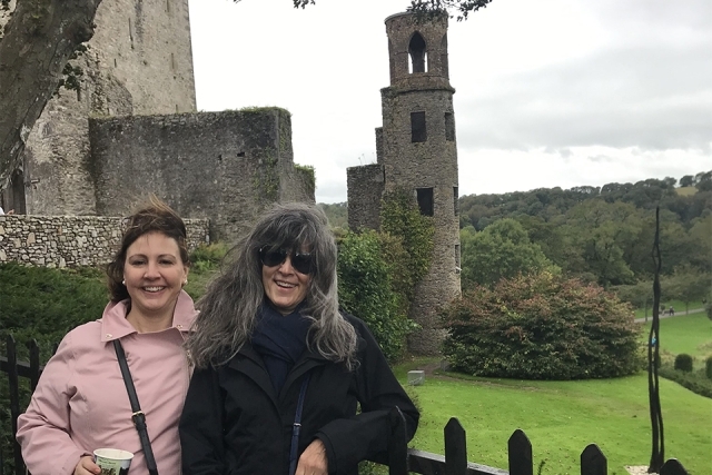 Two women in front of a castle