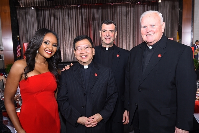 Rahel Solomon ’10TCB and three campus ministry staff members at the St. John’s University 2019 President’s Dinner