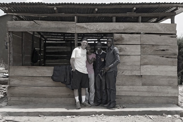 Valeda Dent with three men in Uganda