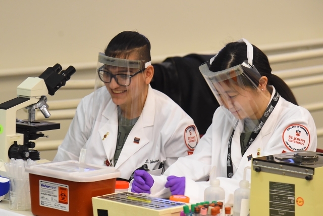 students testing samples in lab