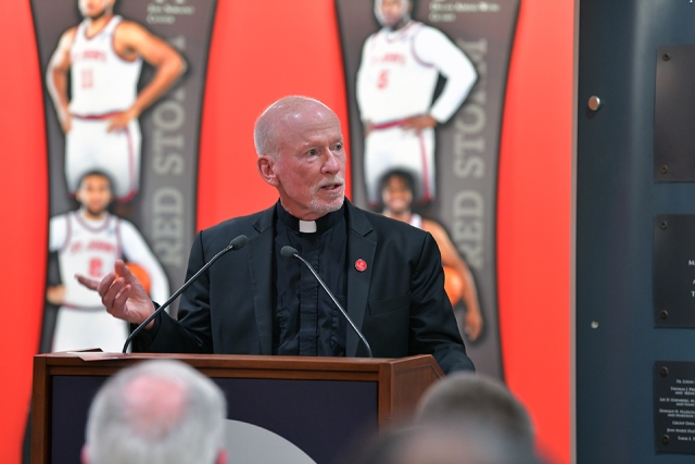 Father Shanley speaking at podium