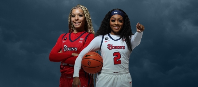 Two St. John's Women's Basketball Players posing infront of dark clouds