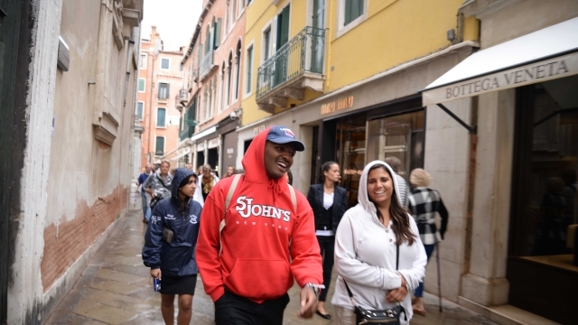 group of St. John's students walking down the street in Rome
