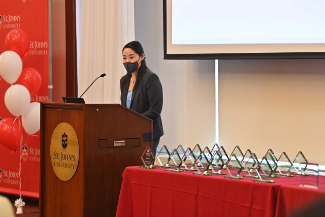 Keaton Wong speaking at the podium at the 2024 Training and Development Certificate Graduation
