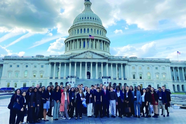 St. John's students pose for photo infront of the capital buildling in Washington DC