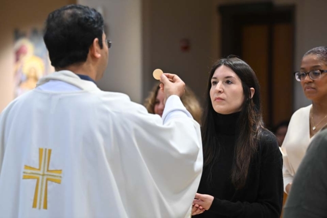 Woman receiving Eucharist