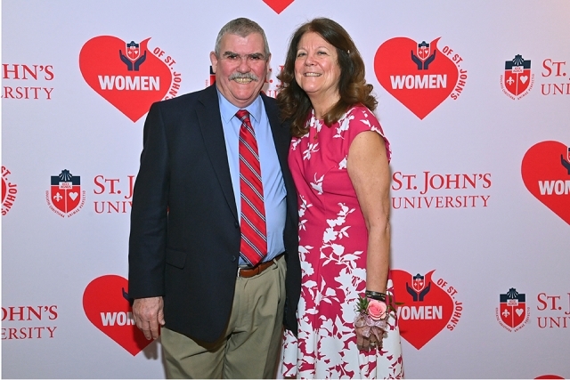 Kathy Meehan and husband infront of step and repeat