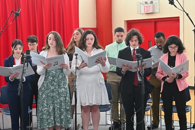 Choir singing during Mass on Staten Island campus