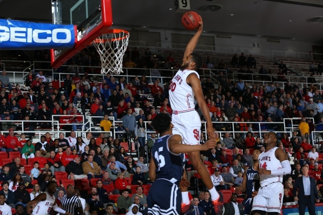 St. John's basketball player about to dunk the ball
