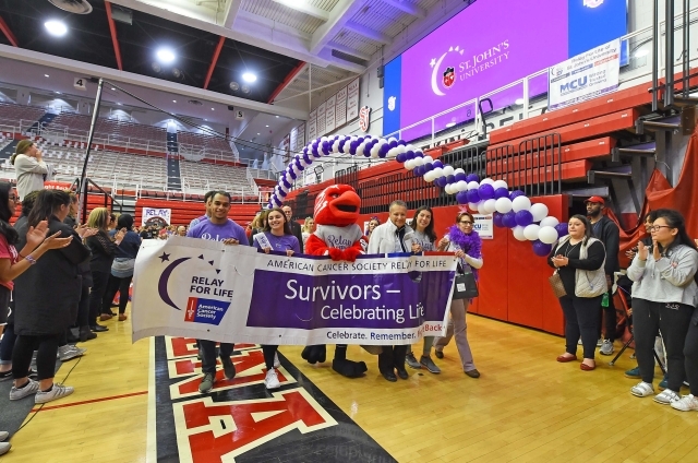 Relay for Life participants holding banner
