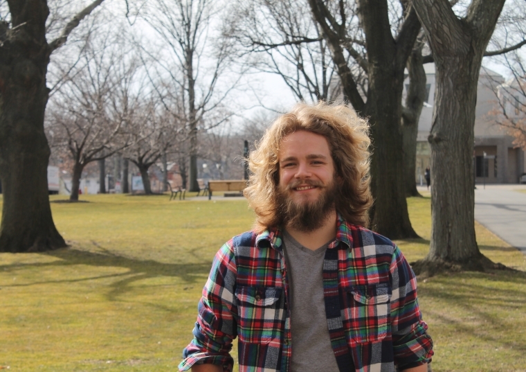 Cole Sagan pictured on the Great Lawn of Queens Campus