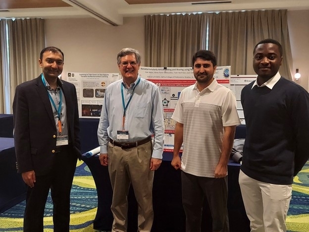 Dr. Bukhari Lab with Dr. Mark Musen Director of the Stanford Center for Biomedical Informatics Research. Dr. Musen was an invited speaker at FLAIRS, visited students' posters, and appreciated the work done by students at St. John’s University. 