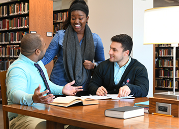 Female faculty and student talking