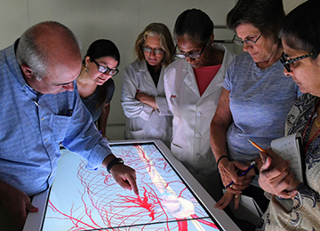 Faculty and Students around anatomage table