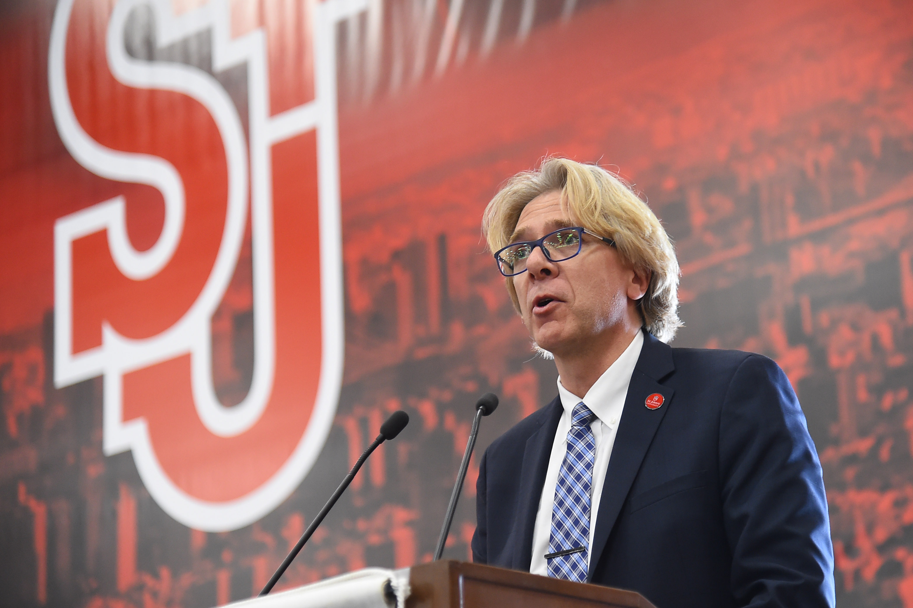 Simon Moller speaking at podium