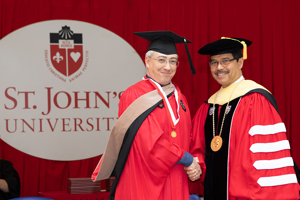 President Gempesaw and person at Rome Commencement
