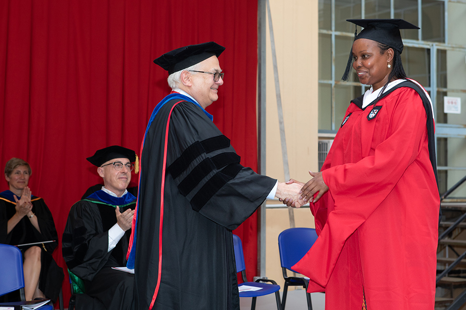 Rome Commencement Exercises attendees shaking hands