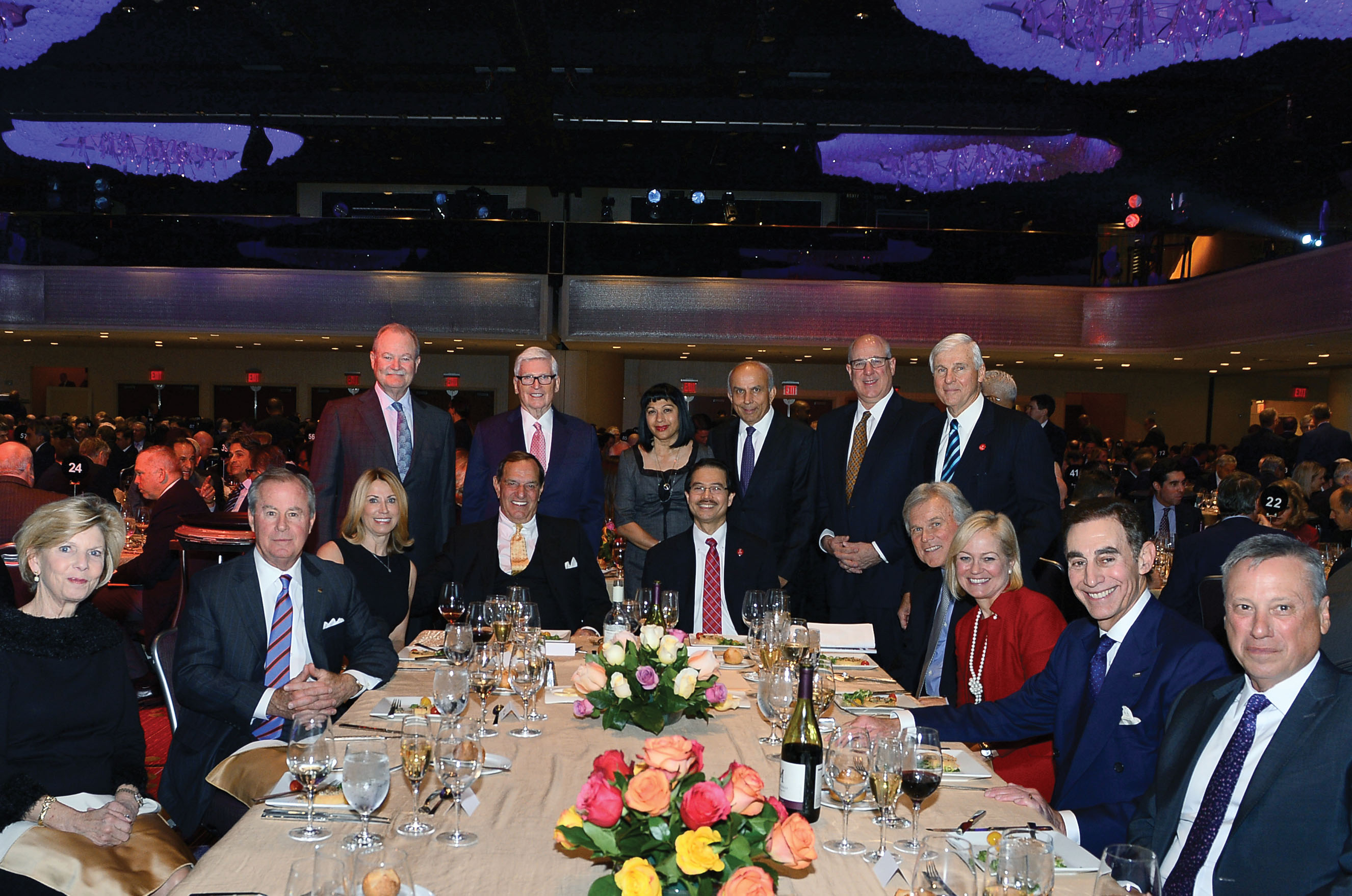 Anthony F. Markel and Conrado “Bobby” Gempesaw, Ph.D., (seated center) join guests at Dinner.