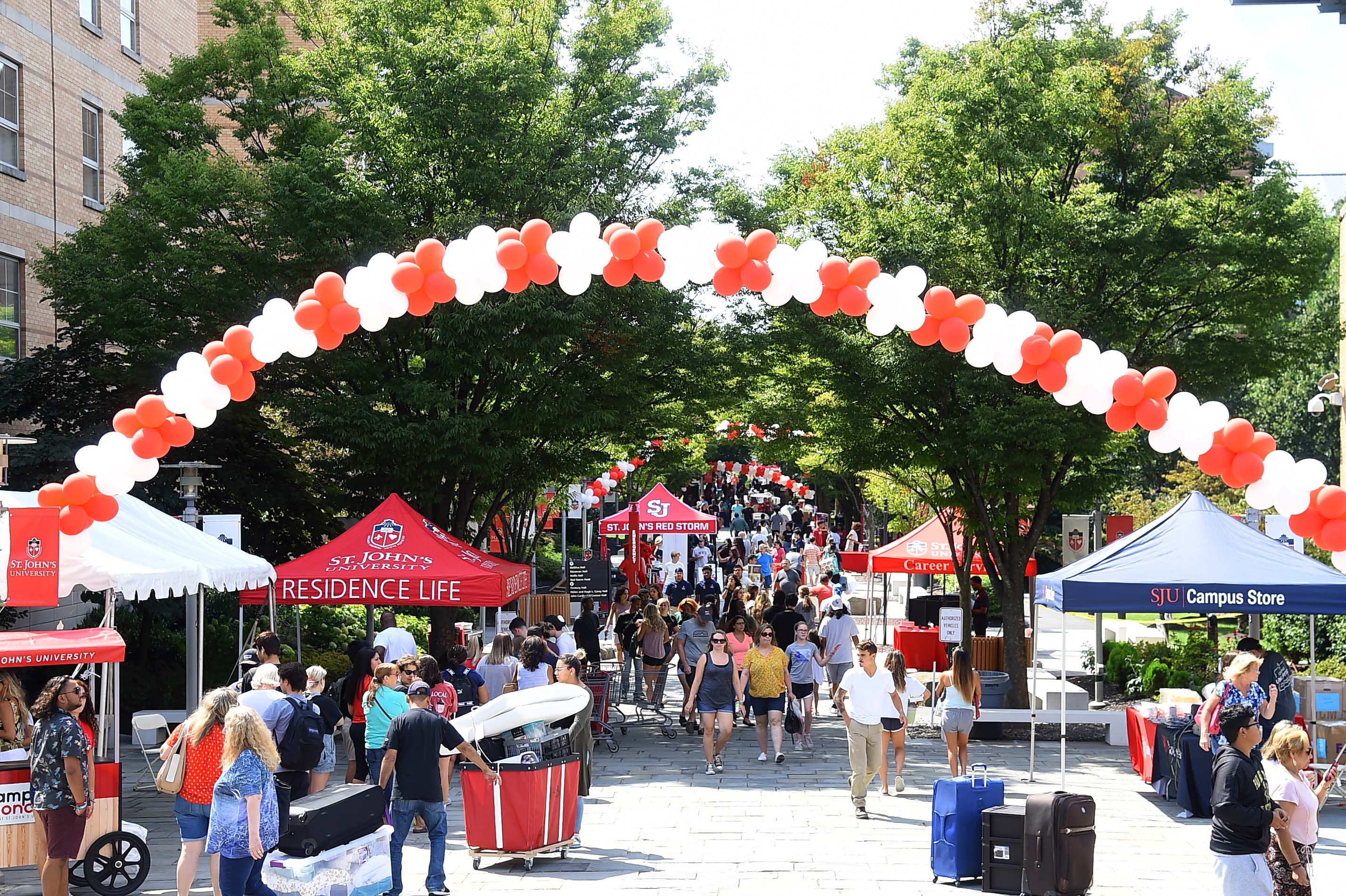 Wide shot of Residence Village with balloon arch