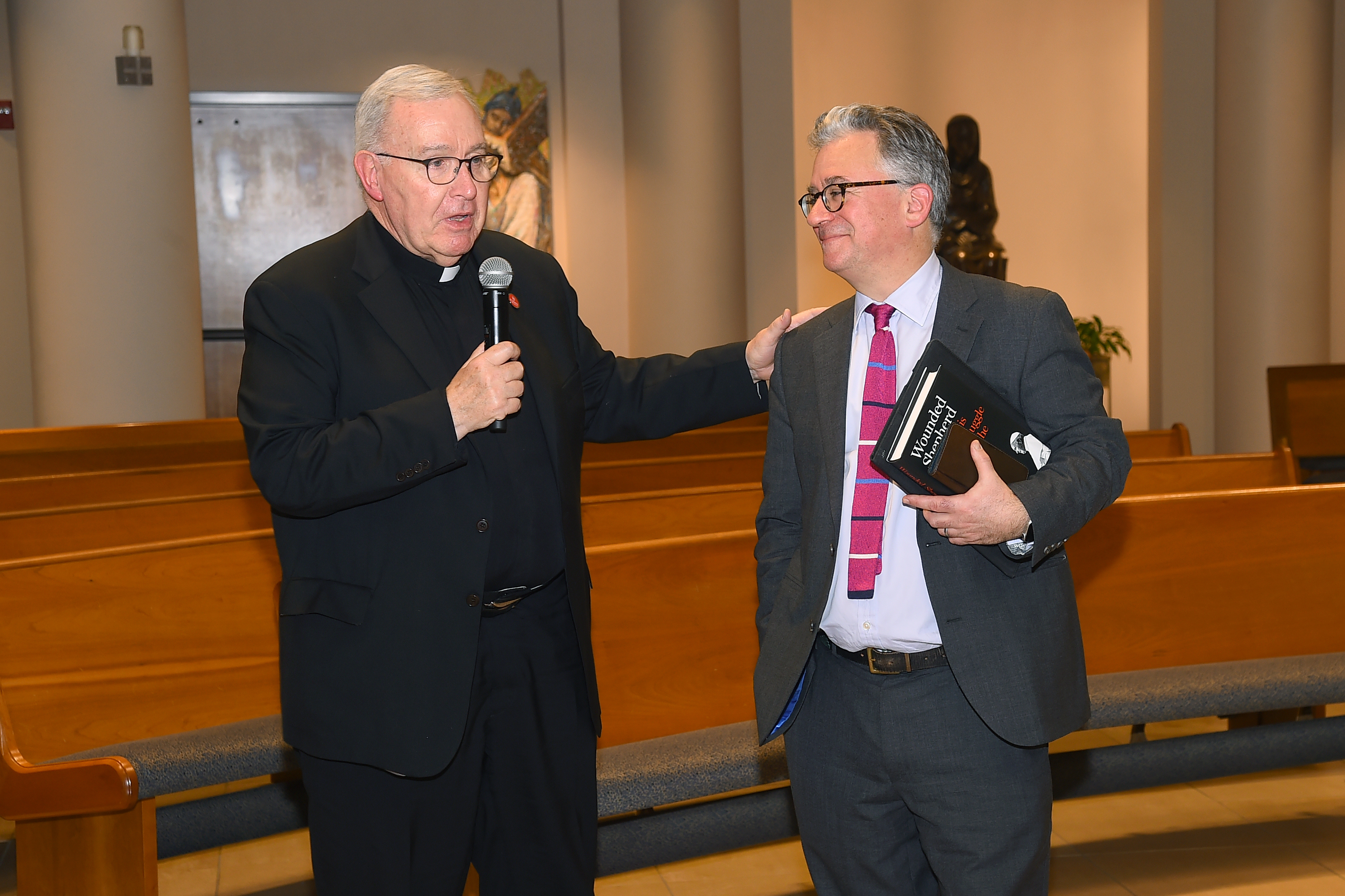 Austen Ivereigh speaking with priest