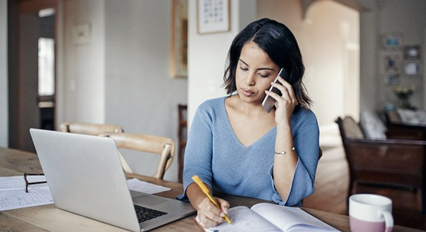 Woman working at a desk from home