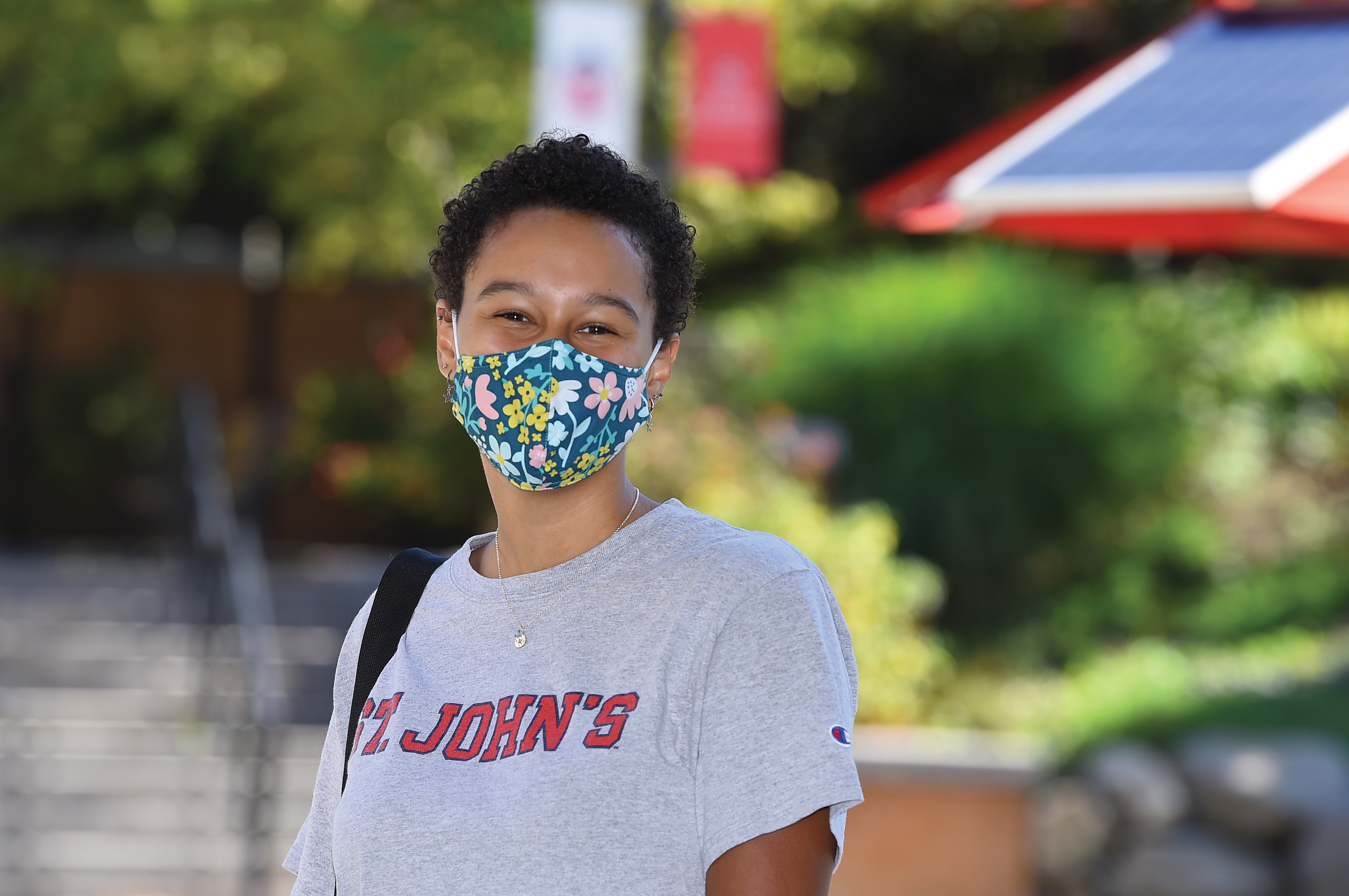 Student in St. John's Shirt wearing face mask