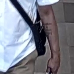 Closeup of mans arm with tattoo