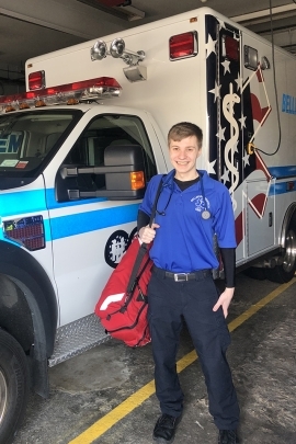 William Jutt in front of ambulance