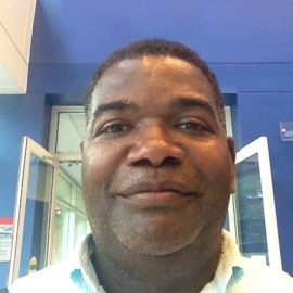 Steven Smithwrick against blue wall