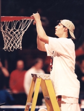 Jonathan Sheiman cutting down basketball net