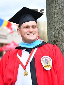 Matthew Kirschenheiter in his cap and gown