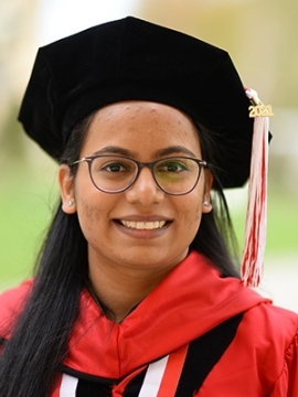 Namosha Mohite in her grad cap and gown