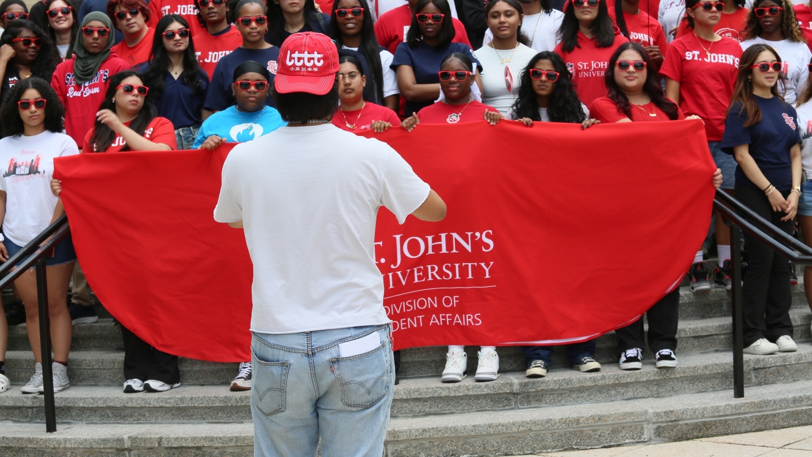 St. John's student in front of a group of prospective undergraduates 