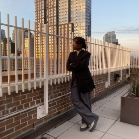 Female, nonprofit leader looking out into the city view 