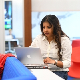 St. John's Student working on laptop in computer lab