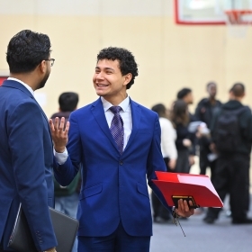 St. John's student speaking to a recruiter at a career fair 