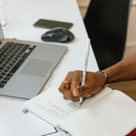 Person doing career research on their labtop 