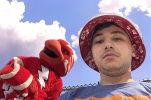Student and St. John's mascot, Johnny Thunderbird