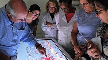 Faculty and Students around anatomage table