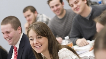 law students sitting in class smilling