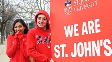 Students holding We Are St. John's sign
