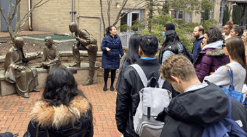 Mission Walking Tour group on Queens Campus