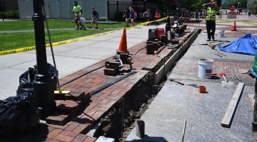 Masonry work being done near Carnesecca Arena