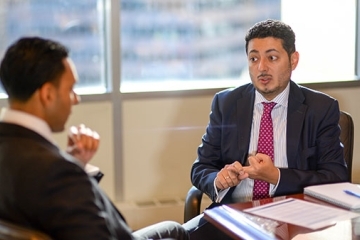 Julian De La Cuesta ’06TCB talks to another male