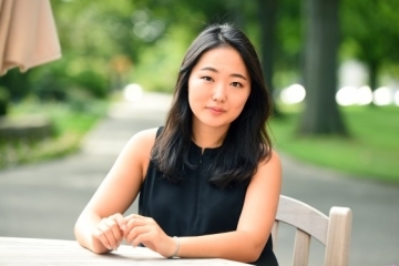 Kisong Kim, Ed.M. headshot, sitting outside