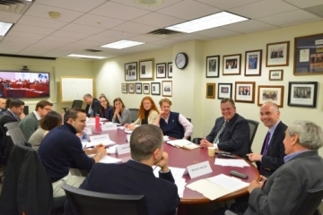 Joint Colloquium members sitting around table