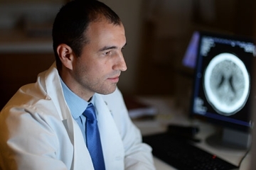 Andriy Vintonyak ‘12P sitting in lab